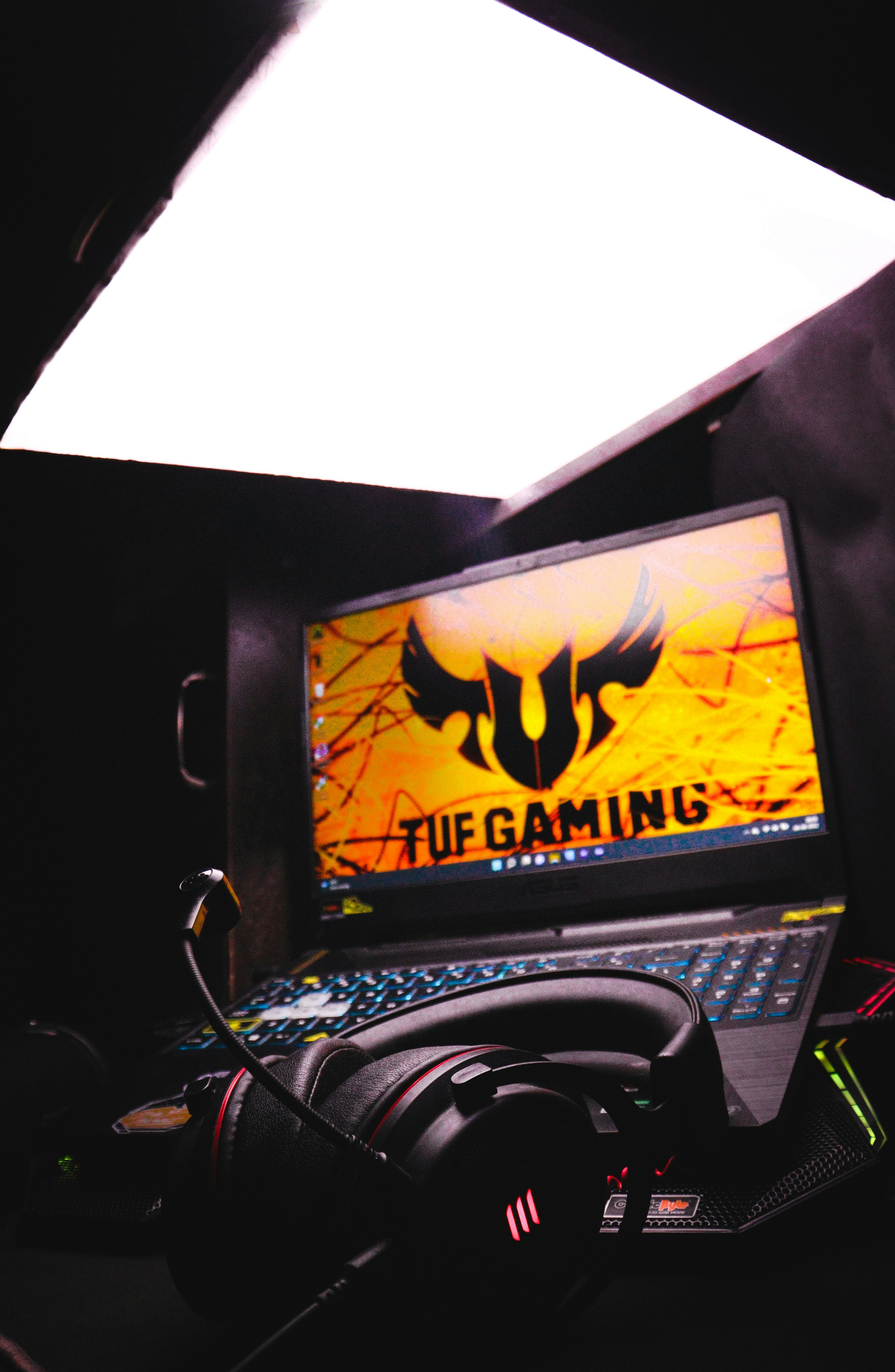 Gaming laptop setup with neon lighting